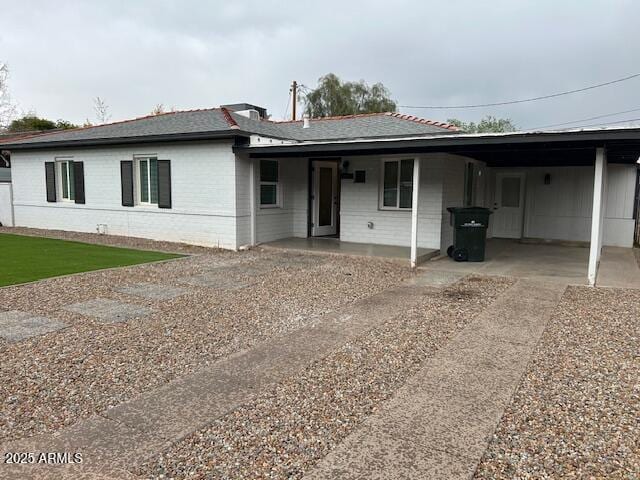 3021 N Randolph Rd, Phoenix, AZ 85014 - view of front of house with a carport