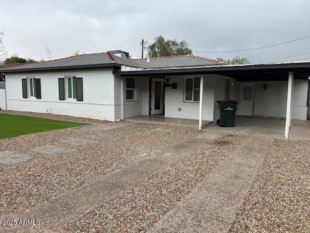 view of front of home with an attached carport