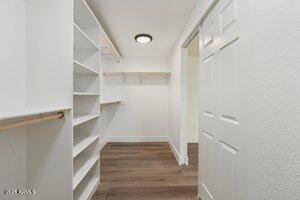 3021 N Randolph Rd, Phoenix, AZ 85014 - walk in closet featuring wood finished floors