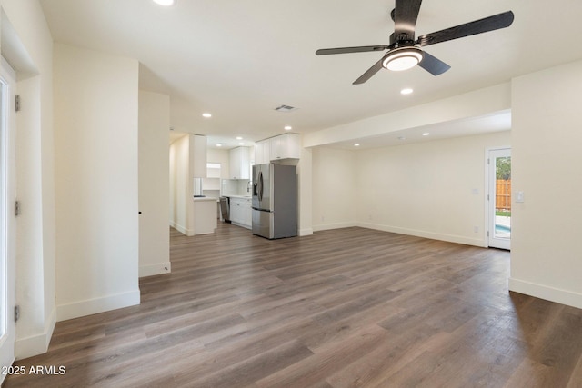 3021 N Randolph Rd, Phoenix, AZ 85014 - unfurnished living room with visible vents, wood finished floors, recessed lighting, baseboards, and ceiling fan