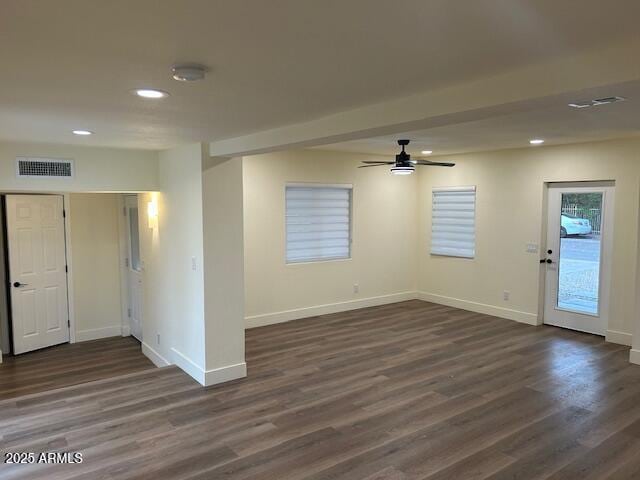 unfurnished room with a ceiling fan, baseboards, visible vents, recessed lighting, and dark wood-type flooring