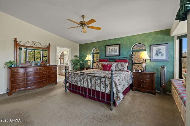 bedroom with wallpapered walls, lofted ceiling, carpet, and ceiling fan