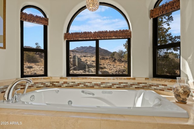 bathroom featuring a tub with jets