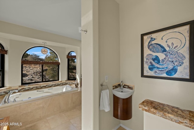 full bath featuring tile patterned floors and a garden tub