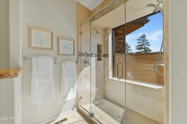 full bathroom featuring a shower stall