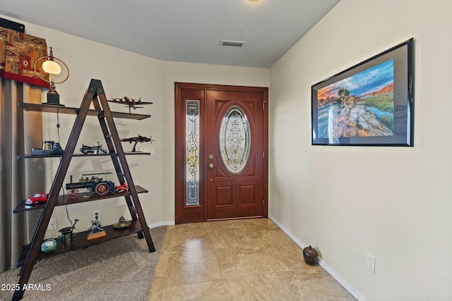 entrance foyer featuring baseboards and visible vents