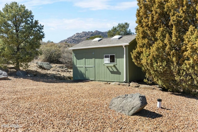 view of shed featuring a mountain view