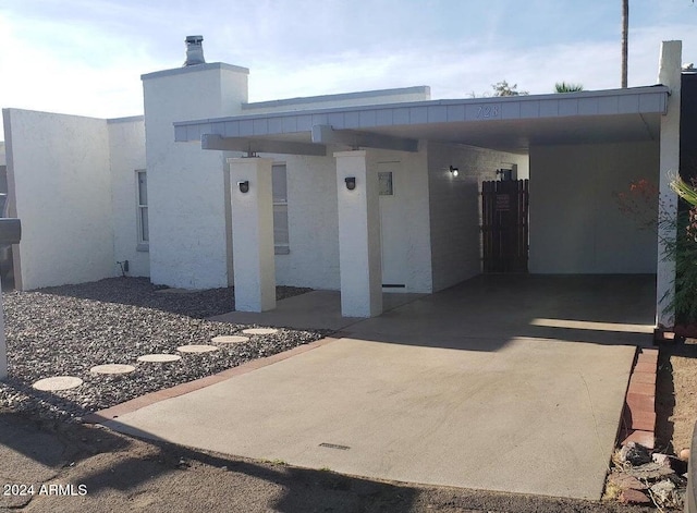 entrance to property with a carport