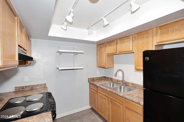 kitchen with sink, rail lighting, a textured ceiling, light tile patterned floors, and black appliances