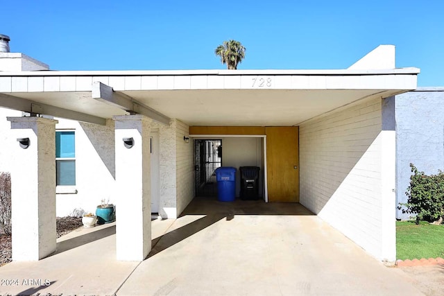 view of patio / terrace featuring a carport