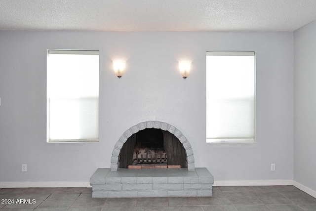 details with a fireplace and a textured ceiling