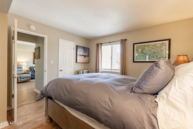 bedroom with light wood-style floors