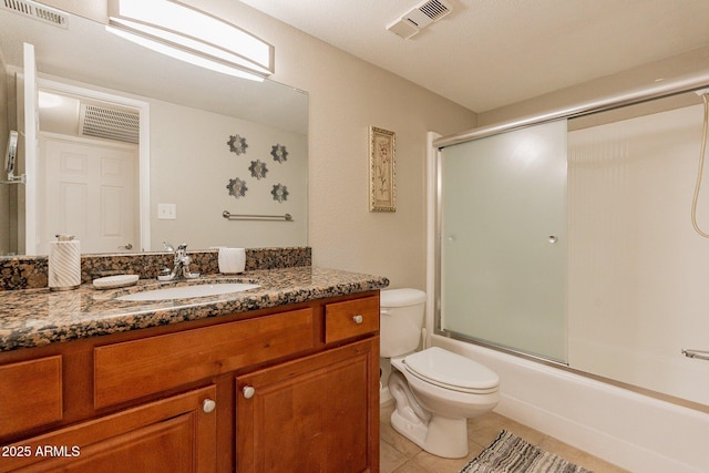 full bathroom with vanity, tile patterned floors, toilet, and visible vents