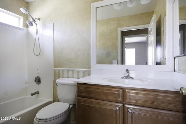 full bath featuring toilet, bathtub / shower combination, and vanity