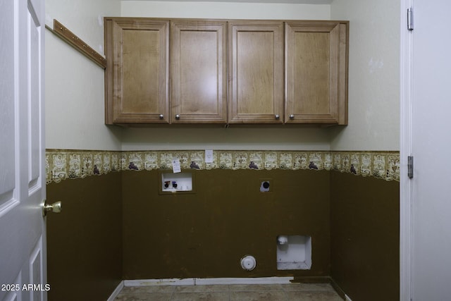 washroom featuring hookup for a gas dryer, hookup for an electric dryer, washer hookup, and cabinet space