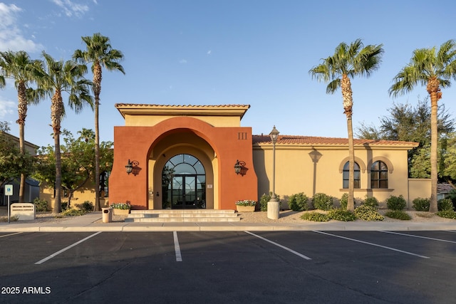 view of building exterior featuring uncovered parking