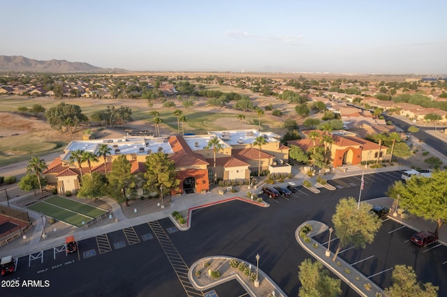 birds eye view of property featuring a mountain view, a residential view, and view of golf course