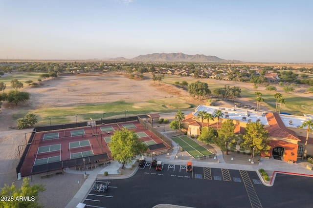 aerial view featuring golf course view and a mountain view