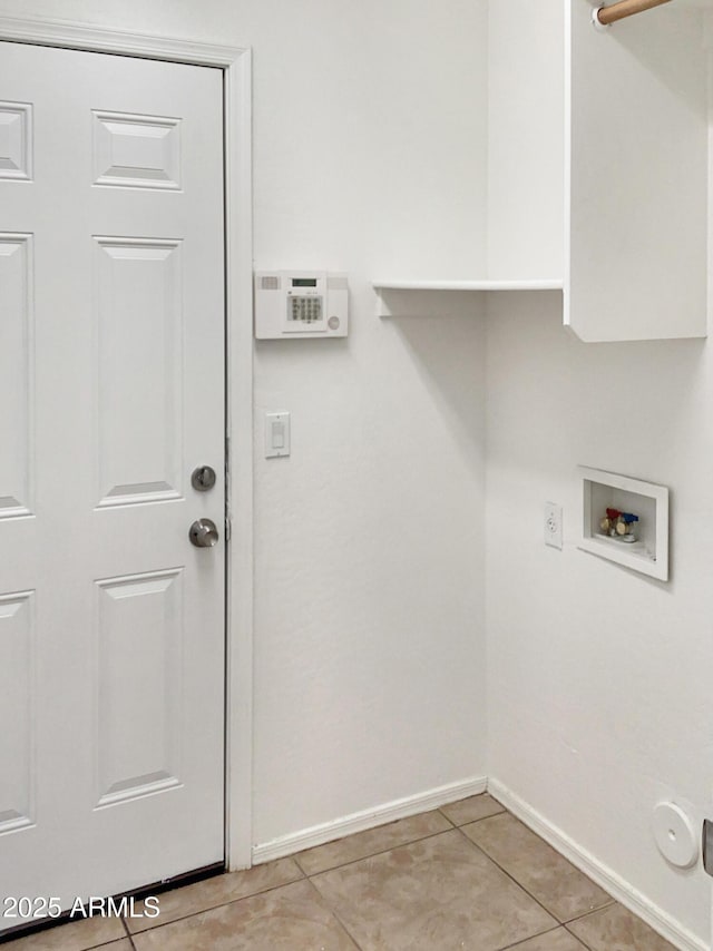 laundry area featuring washer hookup and light tile patterned flooring