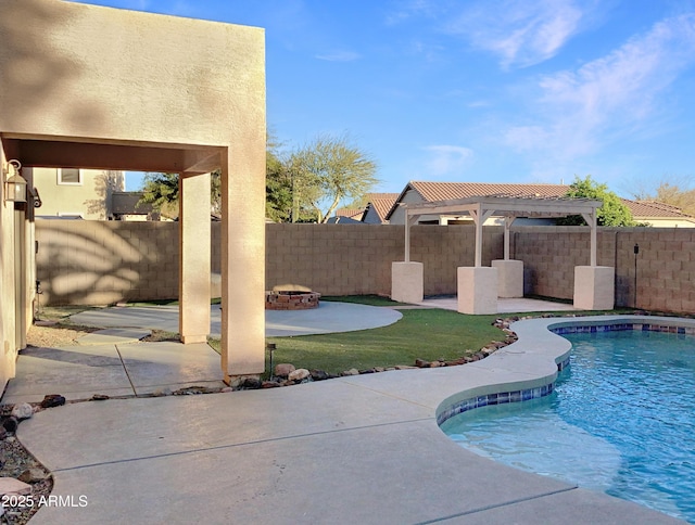 view of swimming pool with a fire pit and a patio