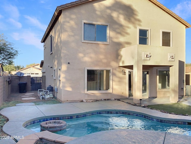 back of house featuring a patio area