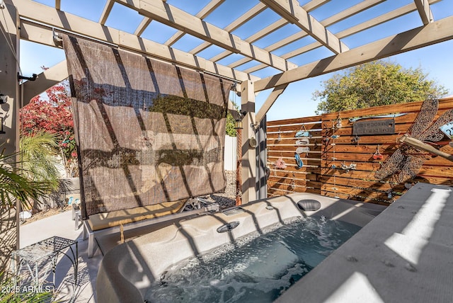 view of patio featuring a pergola and a hot tub