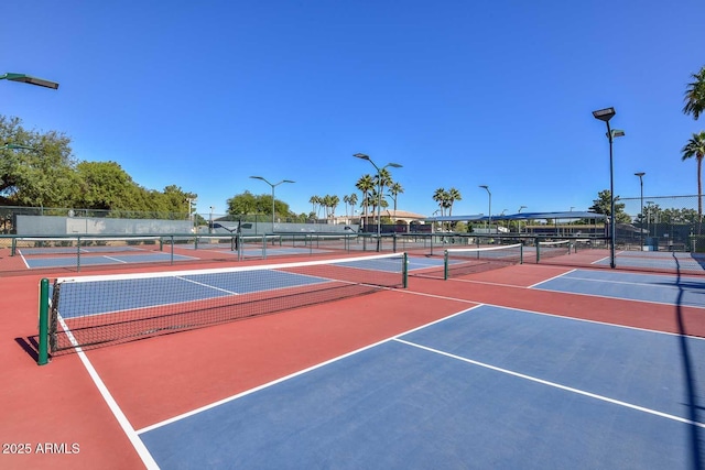 view of sport court with fence