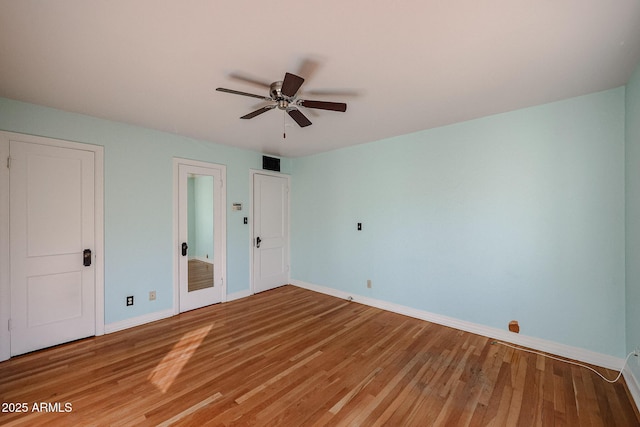 unfurnished bedroom featuring wood-type flooring and ceiling fan