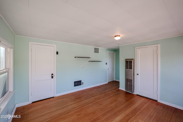 spare room featuring hardwood / wood-style flooring