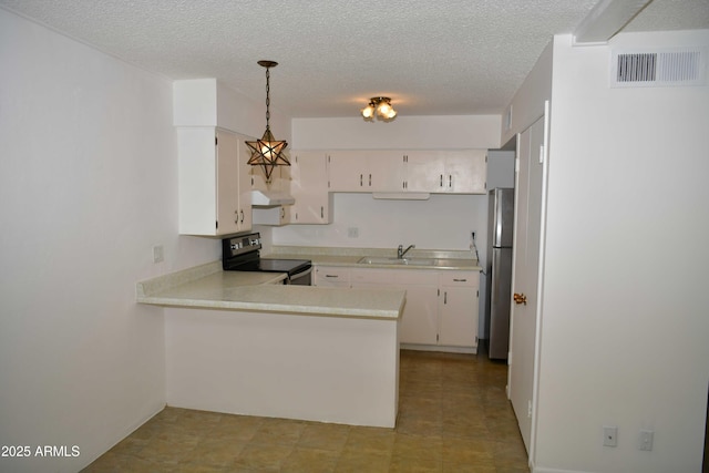 kitchen with pendant lighting, kitchen peninsula, sink, appliances with stainless steel finishes, and white cabinetry