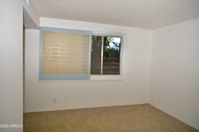 empty room with a textured ceiling