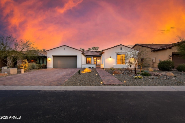 3281 Maverick Dr, Wickenburg, AZ 85390 - mediterranean / spanish-style house featuring driveway, an attached garage, a tiled roof, and stucco siding