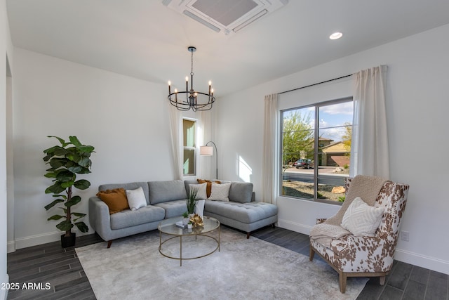 3281 Maverick Dr, Wickenburg, AZ 85390 - living area with wood tiled floor, baseboards, and an inviting chandelier