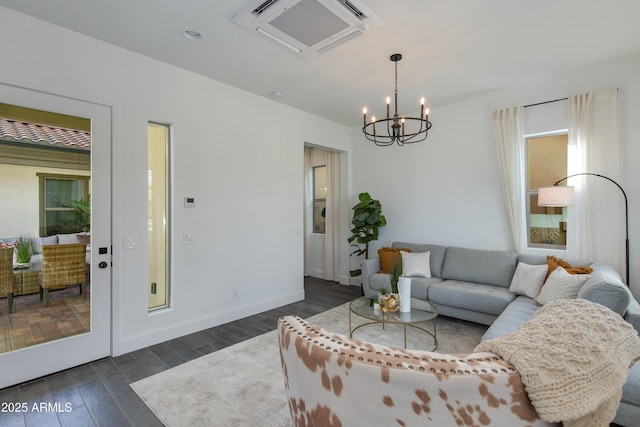 3281 Maverick Dr, Wickenburg, AZ 85390 - living area featuring baseboards, dark wood-style flooring, and a chandelier