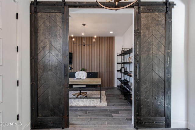 3281 Maverick Dr, Wickenburg, AZ 85390 - home office with a barn door, wood finished floors, and recessed lighting