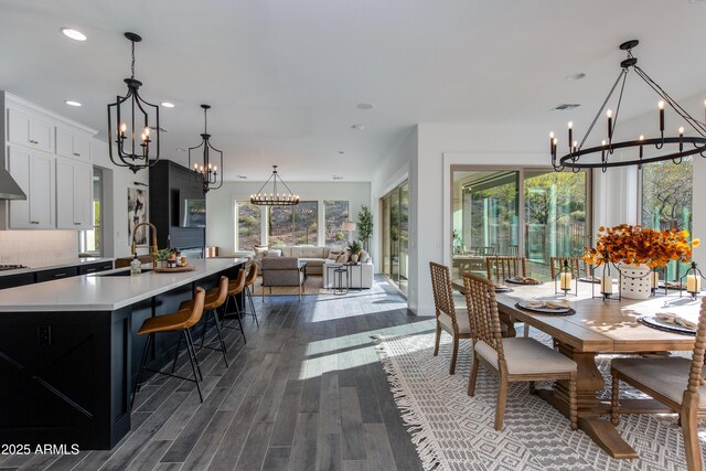 3281 Maverick Dr, Wickenburg, AZ 85390 - dining space featuring visible vents, dark wood-style flooring, recessed lighting, and a chandelier
