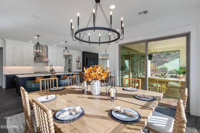 3281 Maverick Dr, Wickenburg, AZ 85390 - dining space with wood finished floors, recessed lighting, a notable chandelier, and visible vents