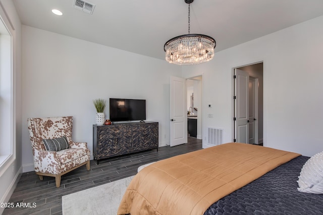 3281 Maverick Dr, Wickenburg, AZ 85390 - bedroom with baseboards, visible vents, a notable chandelier, and wood finish floors