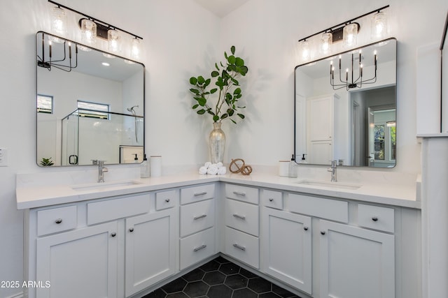 3281 Maverick Dr, Wickenburg, AZ 85390 - full bath featuring a shower with door, double vanity, a sink, and a notable chandelier