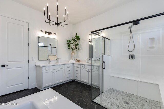 3281 Maverick Dr, Wickenburg, AZ 85390 - bathroom featuring double vanity, a sink, a chandelier, and a shower stall