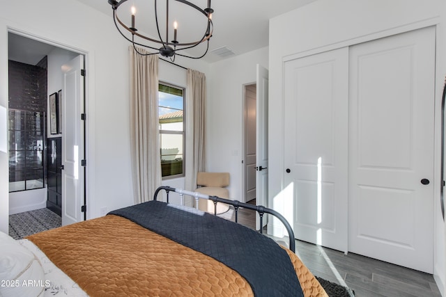 3281 Maverick Dr, Wickenburg, AZ 85390 - bedroom with a closet, dark wood-style flooring, visible vents, ensuite bath, and a notable chandelier