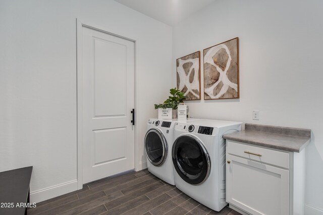 3281 Maverick Dr, Wickenburg, AZ 85390 - washroom featuring baseboards, cabinet space, wood finish floors, and washer and clothes dryer