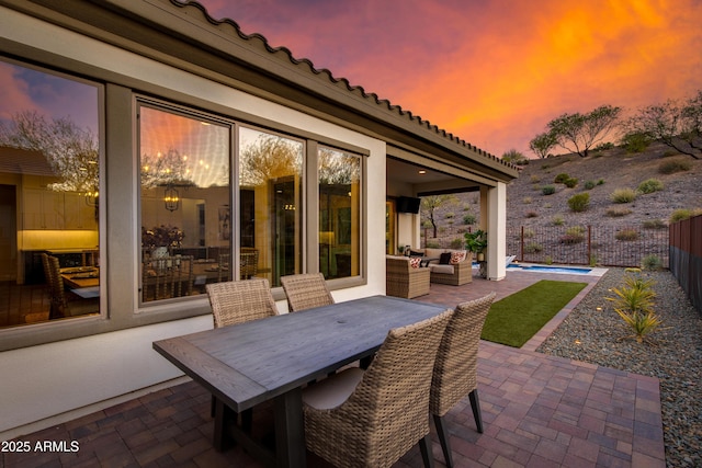3281 Maverick Dr, Wickenburg, AZ 85390 - view of patio with a fenced backyard, outdoor dining area, outdoor lounge area, and a fenced in pool
