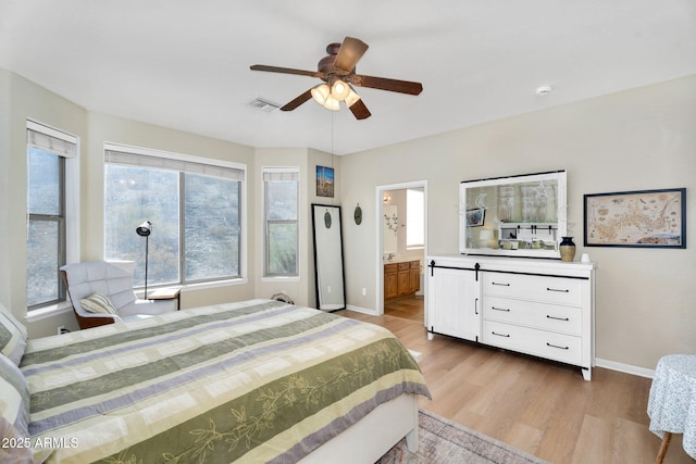 bedroom with connected bathroom, a ceiling fan, baseboards, visible vents, and light wood-style floors