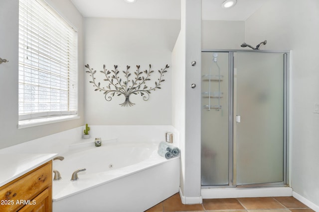 bathroom with a garden tub, tile patterned flooring, vanity, and a stall shower