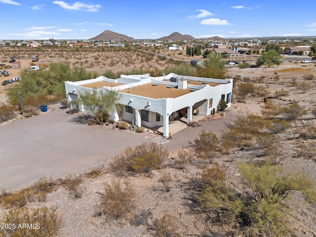 bird's eye view featuring a mountain view and view of desert