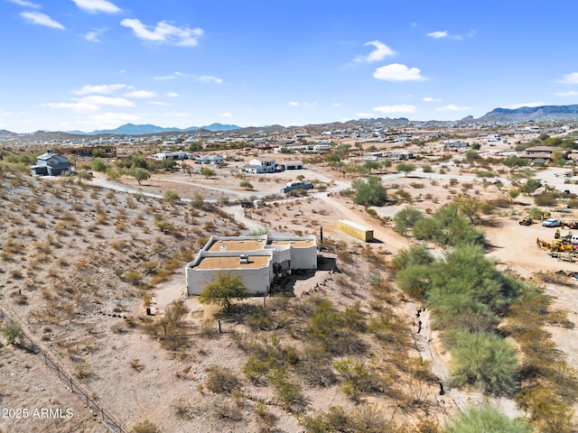 bird's eye view featuring a mountain view and view of desert