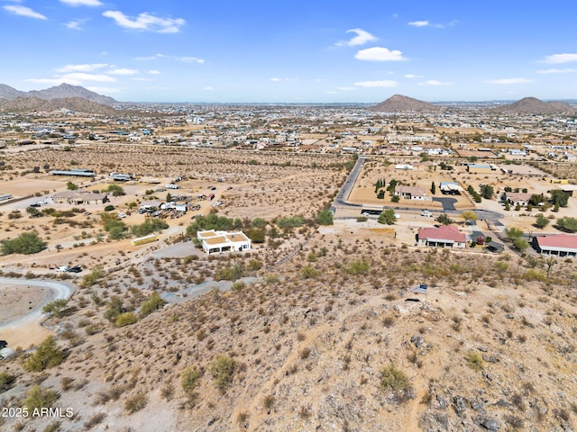 bird's eye view featuring a mountain view and view of desert