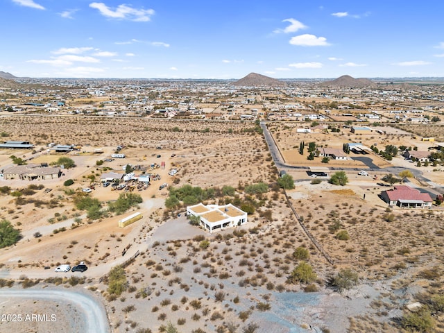 bird's eye view featuring a mountain view and view of desert