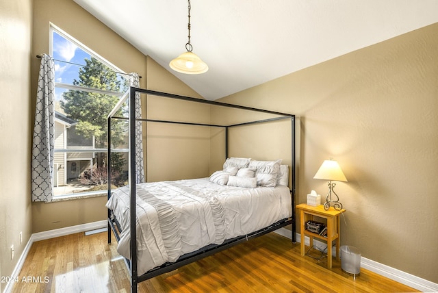 4371 E Savannah Cir, Flagstaff, AZ 86004 - bedroom with lofted ceiling, wood finished floors, and baseboards